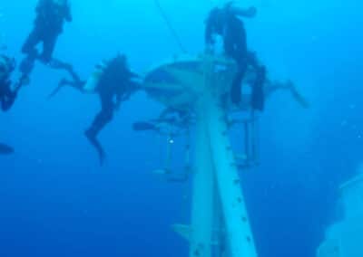 a group of divers diving a wreck in key west